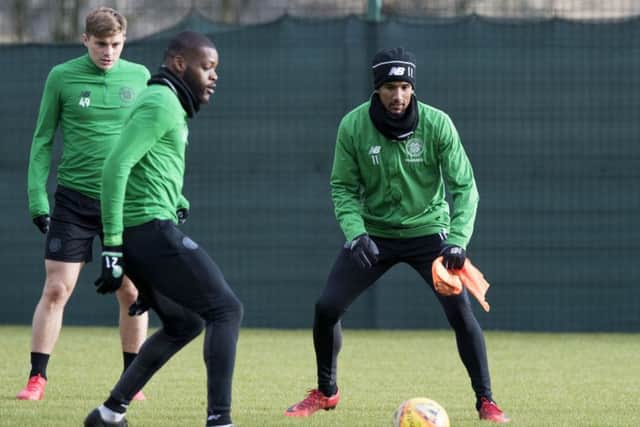Scott Sinclair keeps his eye on the ball as he trains alongside Olivier Ntcham and James Forrest. Picture: SNS