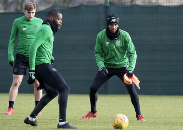 Scott Sinclair keeps his eye on the ball as he trains alongside Olivier Ntcham and James Forrest. Picture: SNS
