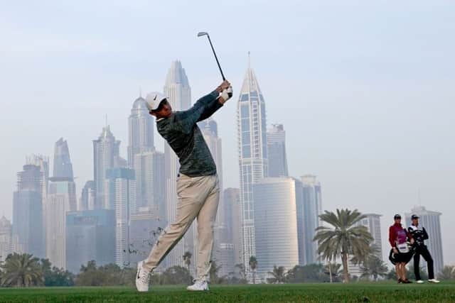 Rory McIlroy plays his second shot to the 13th on the Majlis Course at Emirates Golf Club this morning. Picture: Getty Images