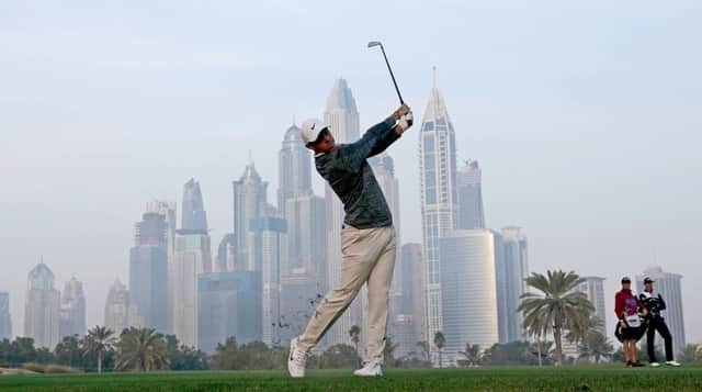 Rory McIlroy plays his second shot to the 13th on the Majlis Course at Emirates Golf Club this morning. Picture: Getty Images