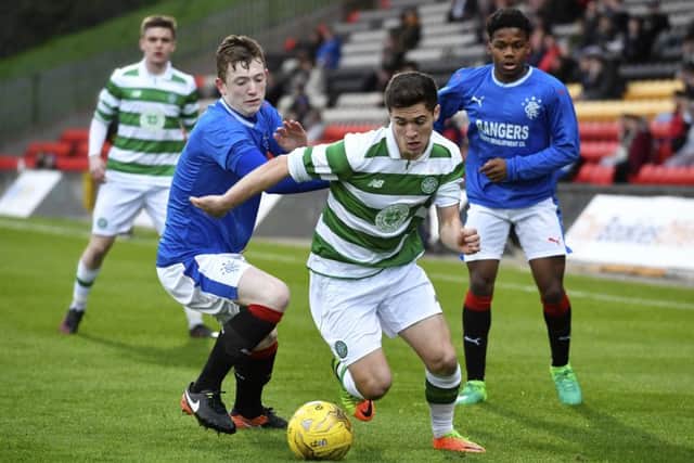 Celtic's Jack Aitchison skips away from Rangers' Daniel Finlayson in the Glasgow Cup. Picture: SNS/Rob Casey