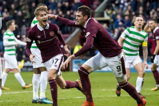 Harry Cochrane (left) celebrates his goal with Kyle Lafferty during Hearts' 4-0 victory over Celtic. Picture: SNS