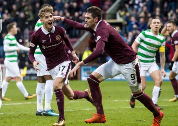 Harry Cochrane (left) celebrates his goal with Kyle Lafferty during Hearts' 4-0 victory over Celtic. Picture: SNS