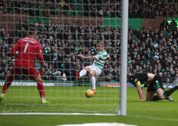 Celtic's Leigh Griffiths nets the winner against Hibernian. Picture: Andrew Milligan/PA Wire