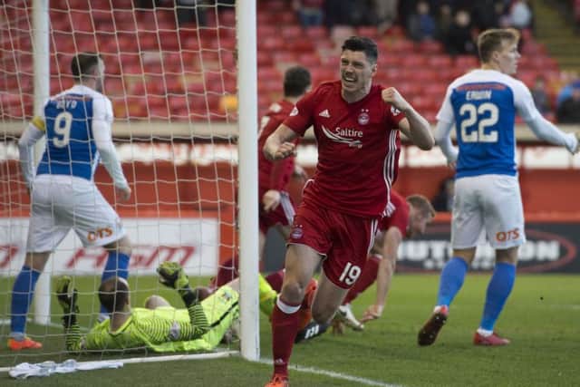 Aberdeen's Scott McKenna celebrates the first of two goals. Picture: SNS/Gary Hutchison
