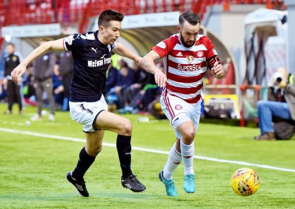 Dundee's Cammy Kerr tussles with Hamilton's Dougie Imrie. Picture: SNS/Ross Parker