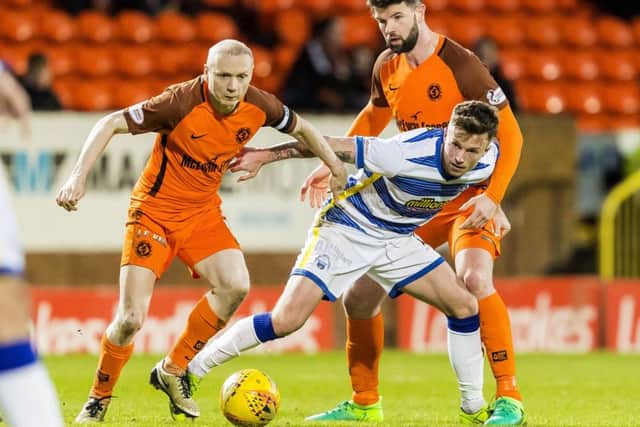 Dundee United's Willo Flood in action against Michael Tidser. Picture: Roddy Scott/SNS