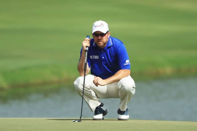 Richie Ramsay lines up his birdie putt at the last as he closed with a 64 in the Omega Dubai Desert Classic. Picture: Getty Images
