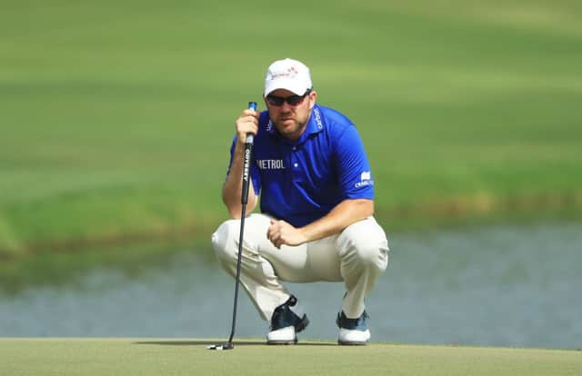 Richie Ramsay lines up his birdie putt at the last as he closed with a 64 in the Omega Dubai Desert Classic. Picture: Getty Images