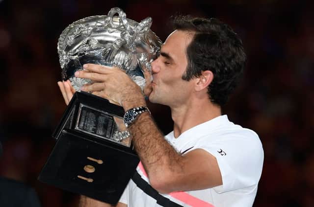 Roger Federer kisses the winner's trophy after beating Croatia's Marin Cilic in their men's singles final. Picture: AFP/Getty