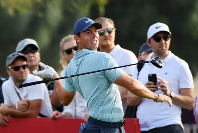 Rory McIlroy reacts to seeing his drive head into the desert at the 16th hole in the final round of the Omega Dubai Desert Classic. Picture: Getty Images