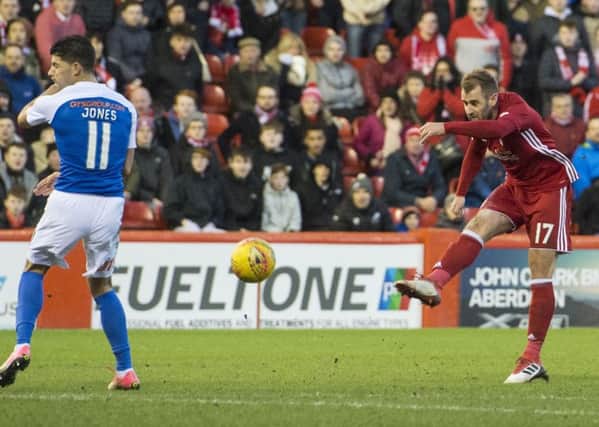 Niall McGinn, after running half the length of the pitch, unleashes a superb strike to put Aberdeen 3-1 ahead. Picture: SNS.