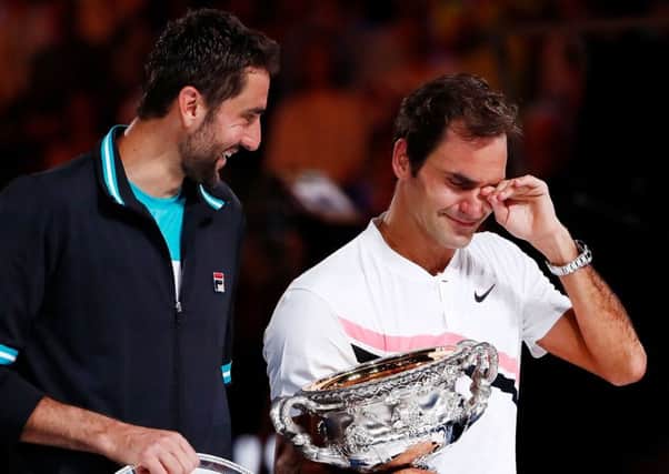 Its all too much for Roger Federer as he breaks down with emotion during the presentation ceremony following his victory over Marin Cilic. Pkicture: Getty.