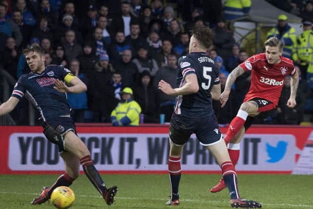 Jason Cummings, right, fires in what would prove to be the winning goal. Picture: SNS