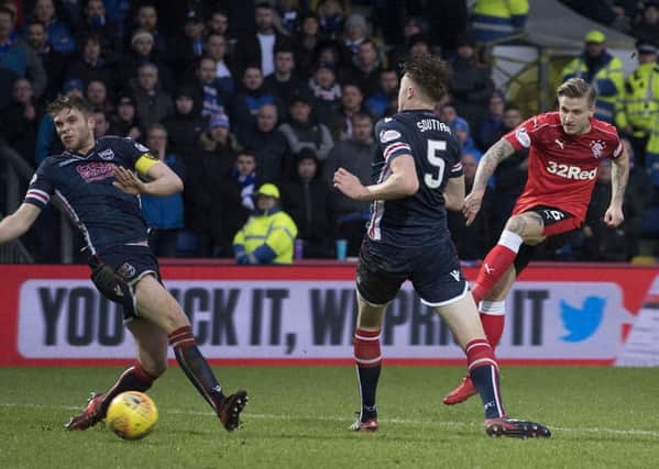 Jason Cummings, right, fires in what would prove to be the winning goal. Picture: SNS