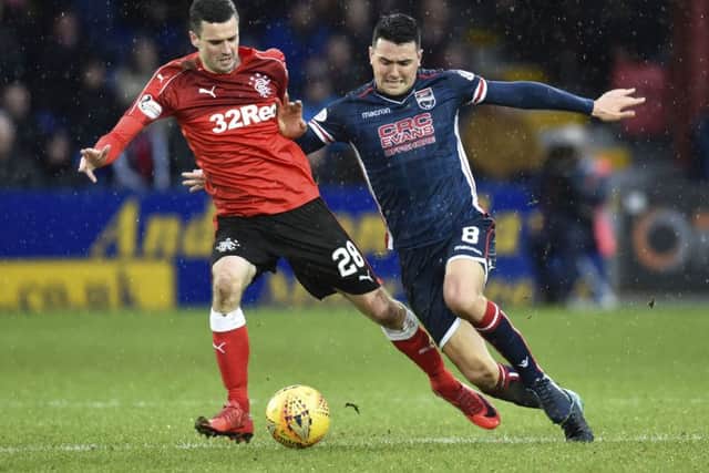 Jamie Murphy battles for possession with Ross County's Tim Chow. Picture: SNS