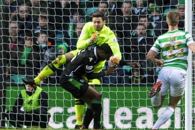 Craig Gordon collided with former team-mate Efe Ambrose in Celtic's 1-0 win over Hibs. Picture: SNS