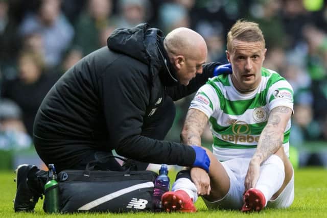 Leigh Griffiths suffered a calf strain in the match with Hibs at Celtic Park. Picture: SNS Group
