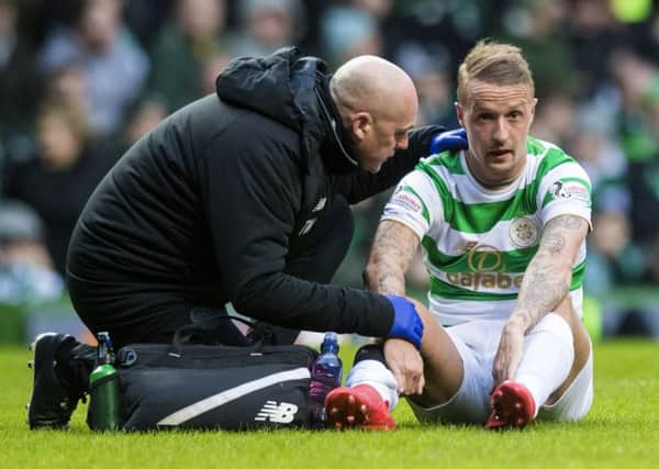 Leigh Griffiths suffered a calf strain in the match with Hibs at Celtic Park. Picture: SNS Group