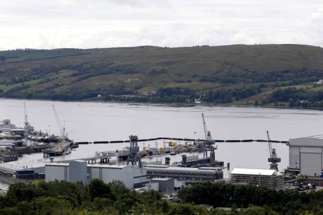 Submarines are seen alongside the jetty at the Royal Navy's submarine base at Faslane. Picture: Russell Cheyne