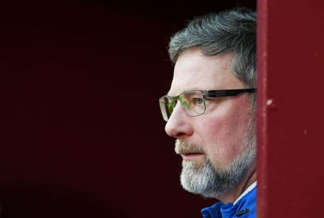 Craig Levein is hoping to bring in another striker and midfielder while not losing any more players. Picture: SNS Group