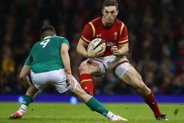 George North, of Wales, is faced by Ireland's Conor Murray during the Six Nations match  at the Principality Stadium in March last year.