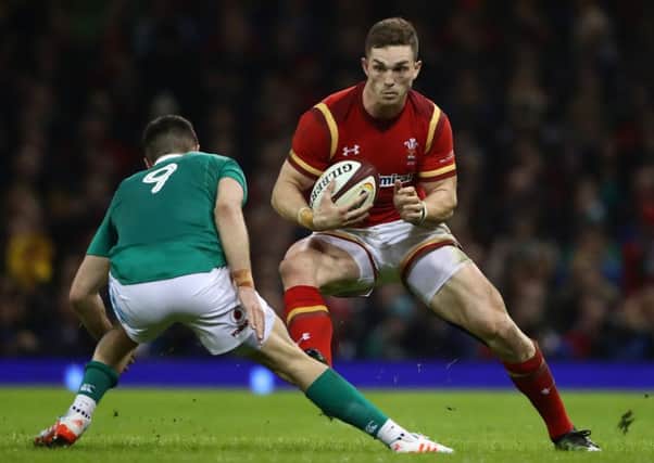 George North, of Wales, is faced by Ireland's Conor Murray during the Six Nations match  at the Principality Stadium in March last year.