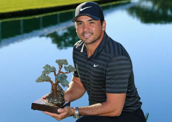 Jason Day with the trophy after winning a play-off at the Farmers Insurance Open at Torrey Pines in San Diego. Picture: Sean M Haffey/Getty Images