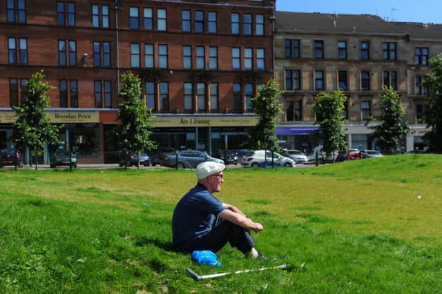 A man enjoys the sun in Mansfield Park in central Partick. Picture: Robert Perry