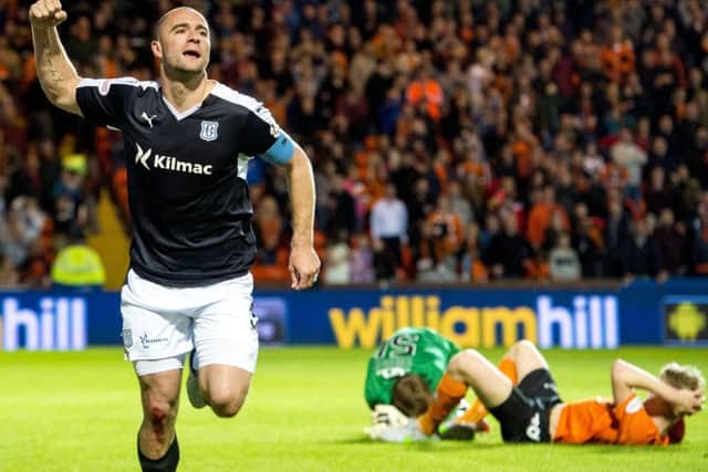 James McPake wheels away after scoring a last minute equaliser against Dundee United at Tannadice. Picture: SNS Group