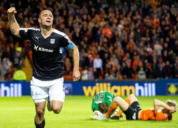 James McPake wheels away after scoring a last minute equaliser against Dundee United at Tannadice. Picture: SNS Group