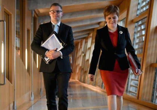 Derek Mackay, pictured here with the First Minister, has secured backing for his budget