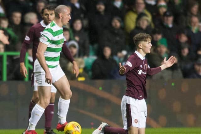 Harry Cochrane, right, was injured in a challenge with Celtic skipper Scott Brown. Picture: SNS