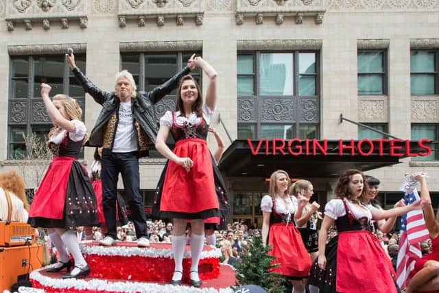 Richard Branson (L) celebrates the grand opening of Virgin Hotels Chicago by recreating the iconic parade scene from Ferris Bueller's Day Off. Picture: Getty Images