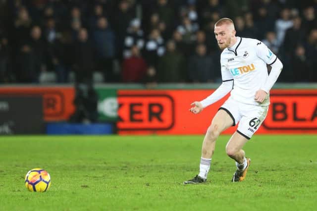 Oli McBurnie in action for Swansewa City against Tottenham Hotspur. Picture: Getty Images