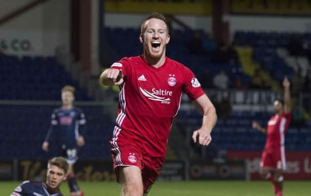 Aberdeen's Adam Rooney celebrates as he makes it 3-0. Picture: SNS