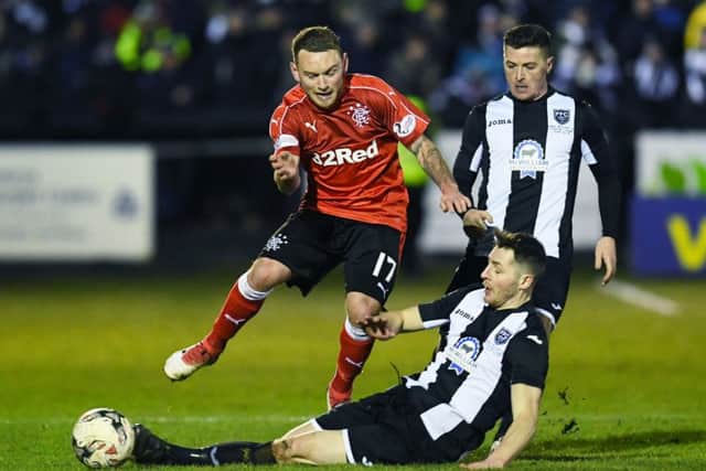 Lee Hodson is challenged by Fraserburgh's Bryan Hay. Picture: SNS Group