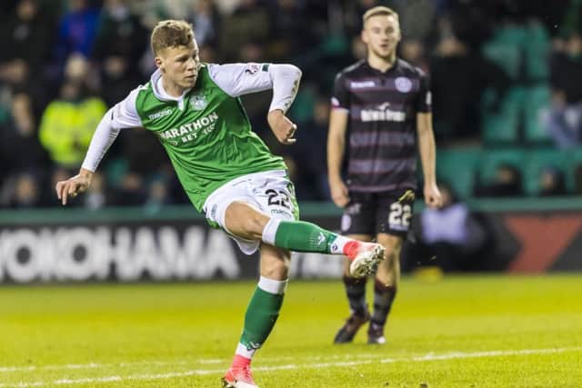 Florian Kamberi, scoring on his debut against Motherwell, wants to say a big thank you to his parents and brother for supporting him. Picture: SNS.