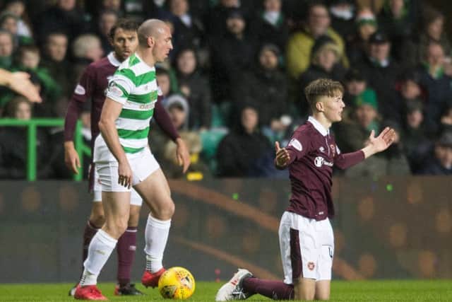 Celtic's Scott Brown and Hearts' Harry Cochrane clashed on Tuesday night. Picture: Ross MacDonald/SNS