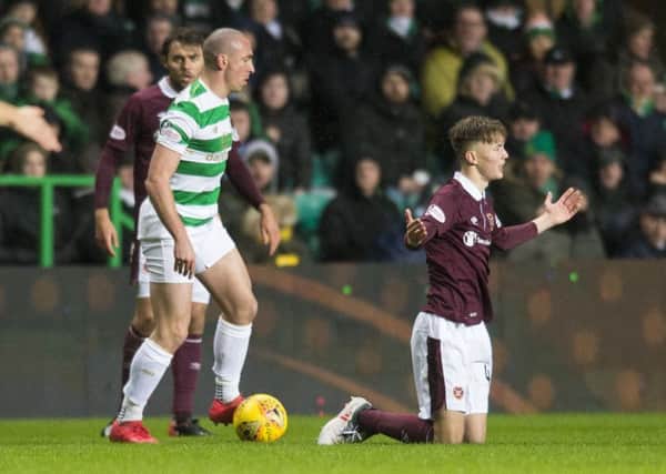Celtic's Scott Brown and Hearts' Harry Cochrane clashed on Tuesday night. Picture: Ross MacDonald/SNS