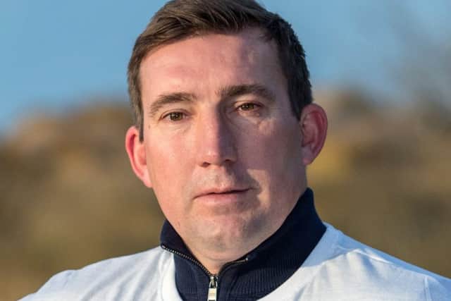Former Everton Player Alan Stubbs shows his support for World Cancer Day.