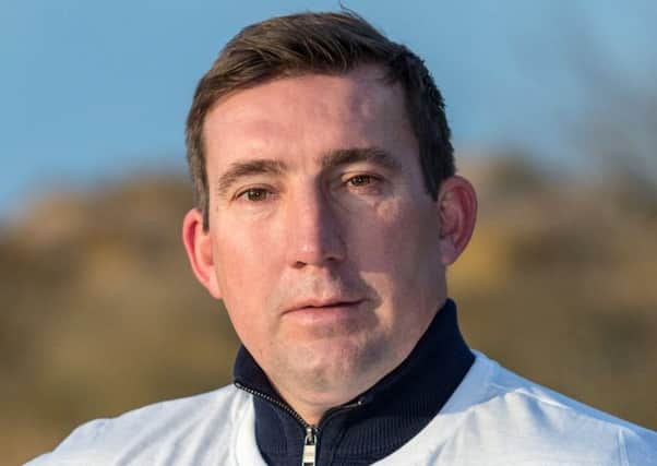 Former Everton Player Alan Stubbs shows his support for World Cancer Day.