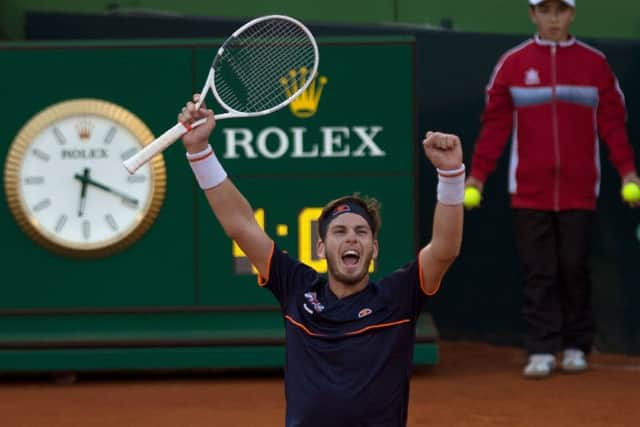 Cameron Norrie shows his delight after defeating Roberto Bautista-Agut to level Great Britains Davis Cup tie against Spain. Picture: AFP/Getty.