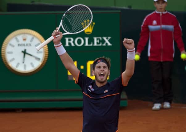 Cameron Norrie shows his delight after defeating Roberto Bautista-Agut to level Great Britains Davis Cup tie against Spain. Picture: AFP/Getty.