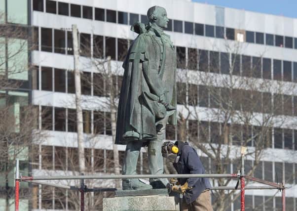 A worker prepares to remove the statue of Edward Cornwallis. Picture: Andrew Vaughan/The Canadian Press via AP
