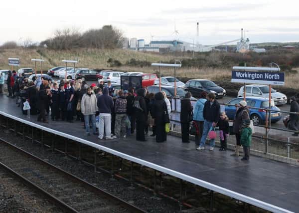 Passengers wait for a train at the temporary Workington North railway station which was built in six days in 2009. Picture: Dave Thompson/PA