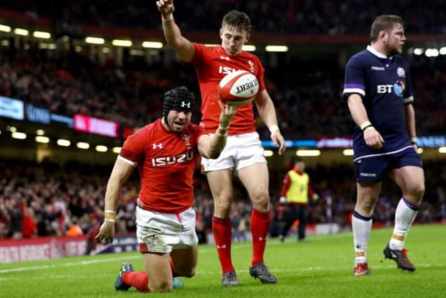 Leigh Halfpenny celebrates scoring Wales' third try in the one-sided encounter. Picture: Getty