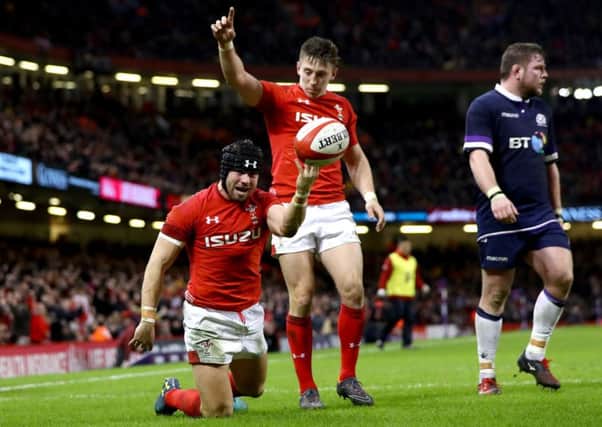 Leigh Halfpenny celebrates scoring Wales' third try in the one-sided encounter. Picture: Getty