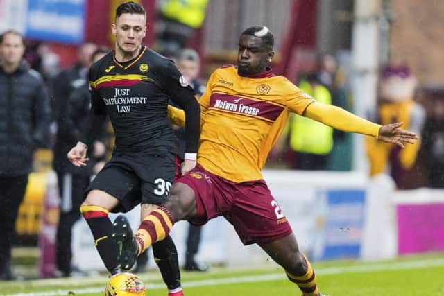 Motherwell's Cedric Kipre and Partick Thistle's Miles Storey in action. Picture: SNS/Roddy Scott
