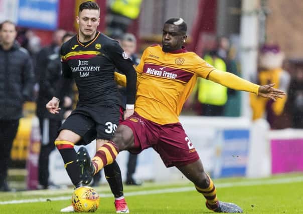 Motherwell's Cedric Kipre and Partick Thistle's Miles Storey in action. Picture: SNS/Roddy Scott